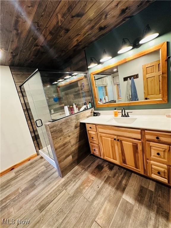 62063 Savage Rd, Cambridge, OH 43725 - full bathroom with wood finished floors, wood ceiling, vanity, and a stall shower