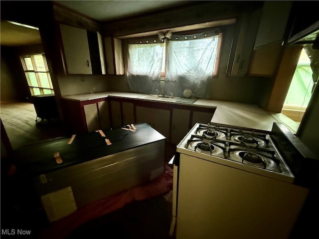 165 Killwell Run Rd, Marietta, OH 45750 - kitchen with range with gas stovetop, light countertops, and plenty of natural light