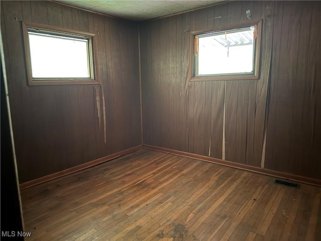 165 Killwell Run Rd, Marietta, OH 45750 - empty room featuring wood-type flooring and wooden walls