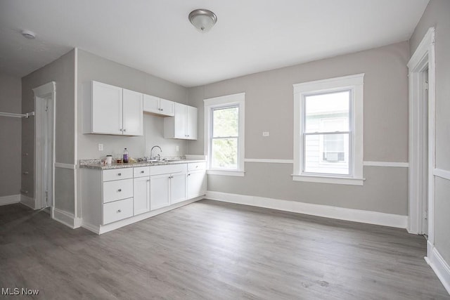 15517 Kipling Ave, Cleveland, OH 44110 - kitchen with wood finished floors and white cabinetry