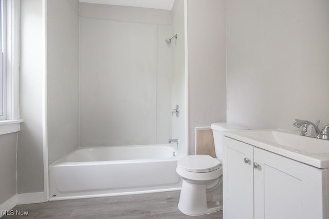 15517 Kipling Ave, Cleveland, OH 44110 - bathroom featuring wood finished floors, vanity, and bathtub / shower combination