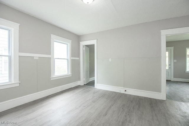 15517 Kipling Ave, Cleveland, OH 44110 - spare room with wood finished floors and baseboards