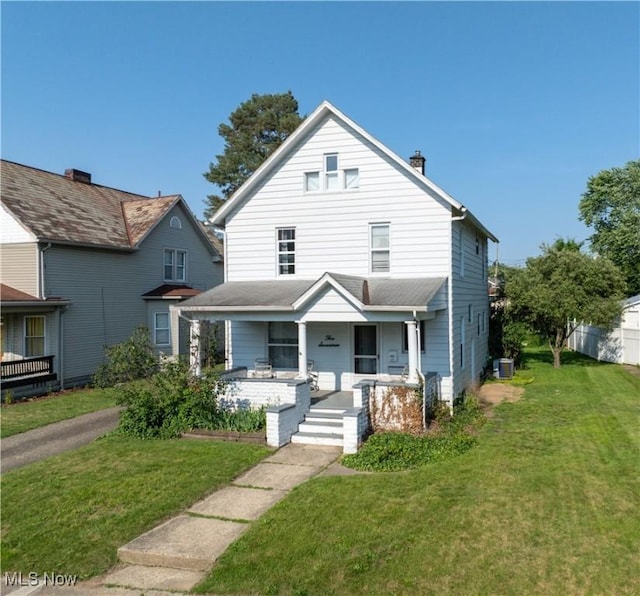 517 3rd St NW, New Philadelphia, OH 44663 - american foursquare style home featuring covered porch and a front yard