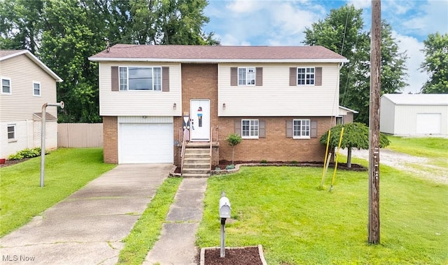 1902 26th Ave, Parkersburg, WV 26101 - split foyer home featuring brick siding, driveway, and a garage