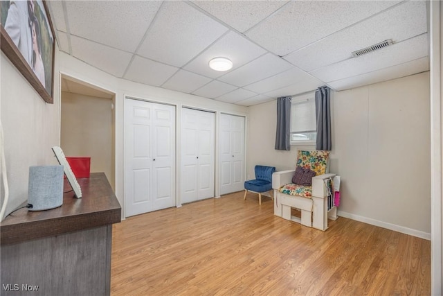 1902 26th Ave, Parkersburg, WV 26101 - living area with light wood-type flooring and a drop ceiling