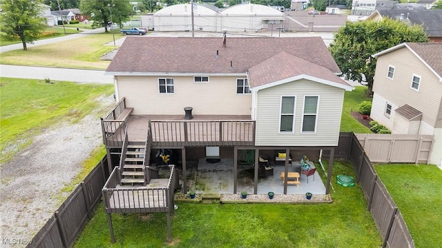 1902 26th Ave, Parkersburg, WV 26101 - rear view of house with a wooden deck, a fenced backyard, a patio area, and a shingled roof