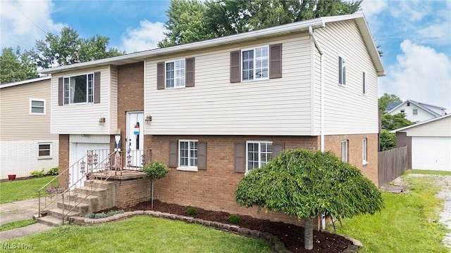 1902 26th Ave, Parkersburg, WV 26101 - bi-level home with a front lawn and brick siding