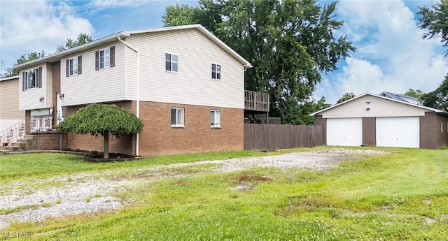 1902 26th Ave, Parkersburg, WV 26101 - view of side of home with a garage, an outbuilding, and brick siding