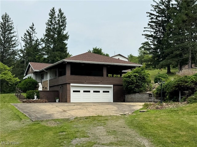 1281 Township Road 129, Adena, OH 43901 - view of property exterior with a garage, driveway, a yard, and roof with shingles