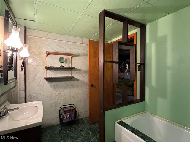 1281 Township Road 129, Adena, OH 43901 - bathroom featuring a garden tub and vanity