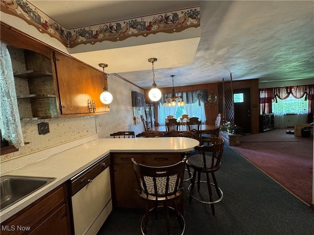 1281 Township Road 129, Adena, OH 43901 - kitchen with stainless steel dishwasher, light countertops, a chandelier, open shelves, and a peninsula