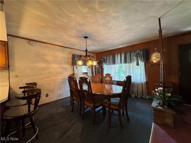 1281 Township Road 129, Adena, OH 43901 - carpeted dining area with a chandelier and baseboards
