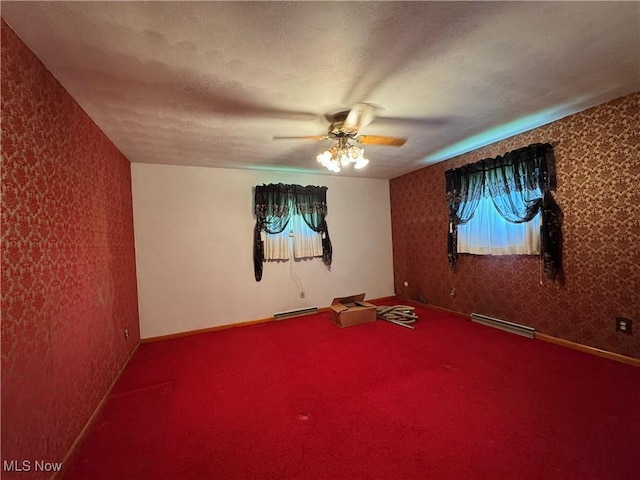 1281 Township Road 129, Adena, OH 43901 - empty room featuring ceiling fan, carpet floors, wallpapered walls, and a textured ceiling