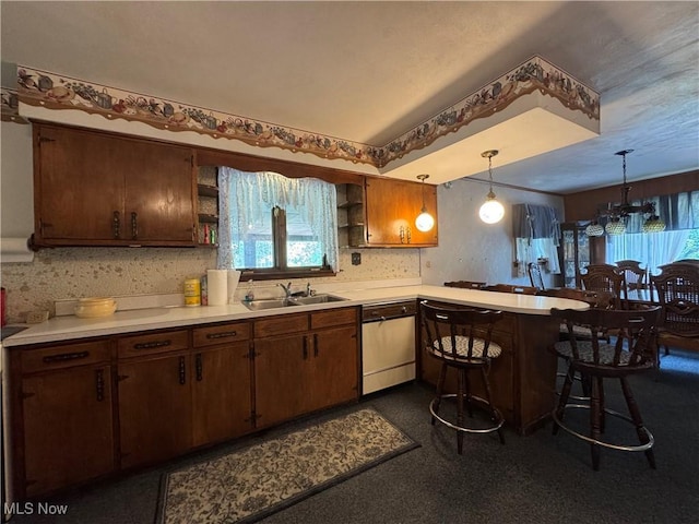 1281 Township Road 129, Adena, OH 43901 - kitchen featuring white dishwasher, open shelves, a peninsula, light countertops, and decorative light fixtures