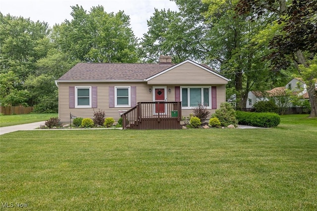 4050 Walter Rd, North Olmsted, OH 44070 - ranch-style home with a chimney, a front lawn, and roof with shingles