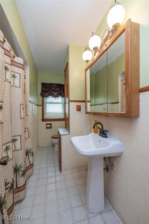 4050 Walter Rd, North Olmsted, OH 44070 - bathroom featuring toilet and tile patterned floors