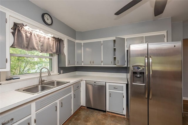 4050 Walter Rd, North Olmsted, OH 44070 - kitchen with stainless steel appliances, a ceiling fan, light countertops, and stone finish flooring