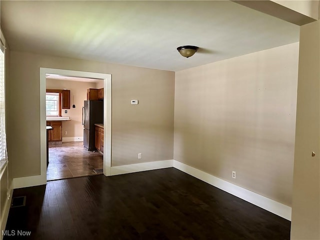 25 W Water St, Hubbard, OH 44425 - unfurnished room featuring dark wood-type flooring and baseboards