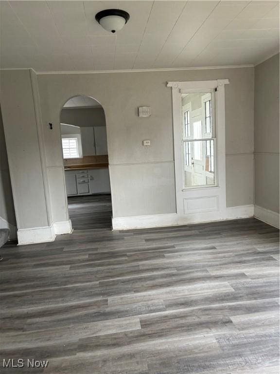 445 N 3rd, Cambridge, OH 43725 - spare room with crown molding, wood finished floors, and arched walkways