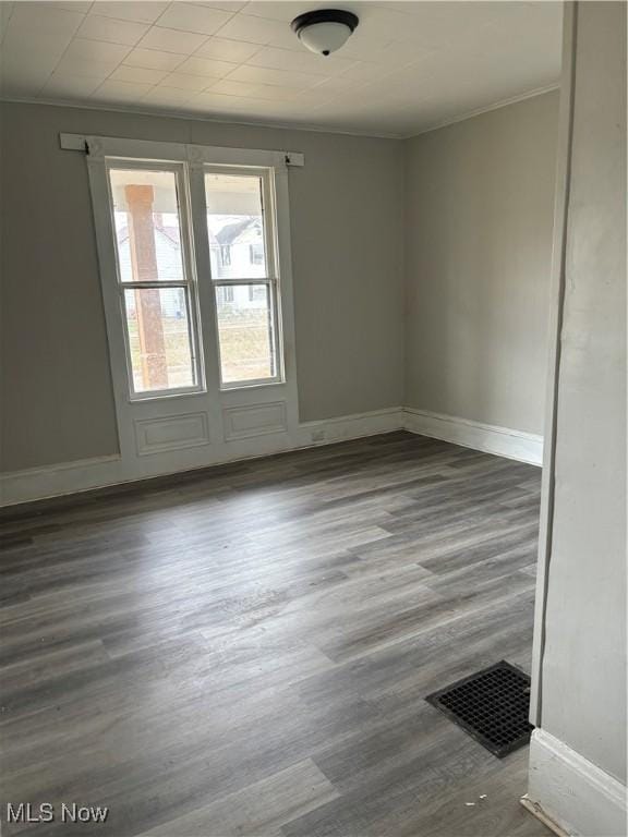 445 N 3rd, Cambridge, OH 43725 - spare room with wood finished floors and ornamental molding