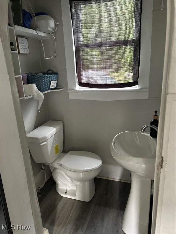 445 N 3rd, Cambridge, OH 43725 - half bathroom with plenty of natural light and wood finished floors