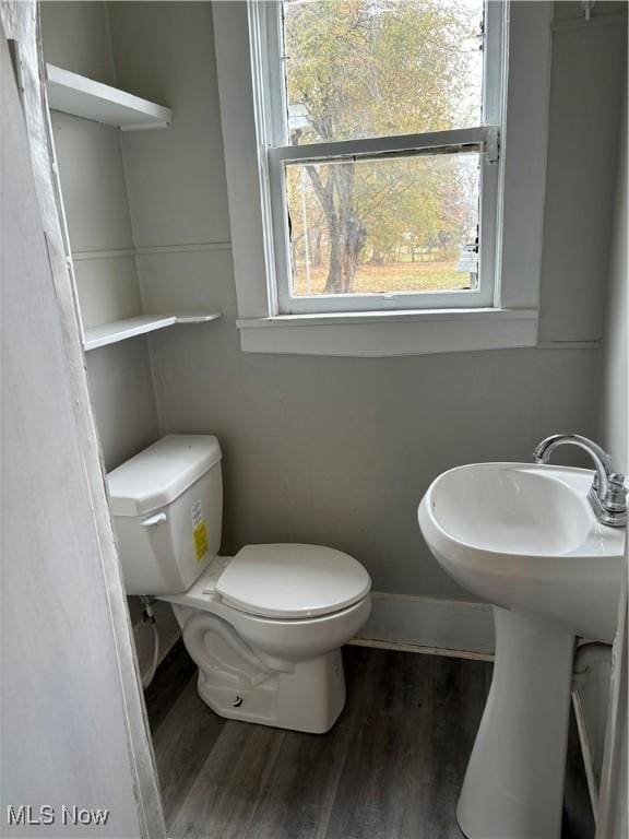 445 N 3rd, Cambridge, OH 43725 - half bath featuring toilet and wood finished floors