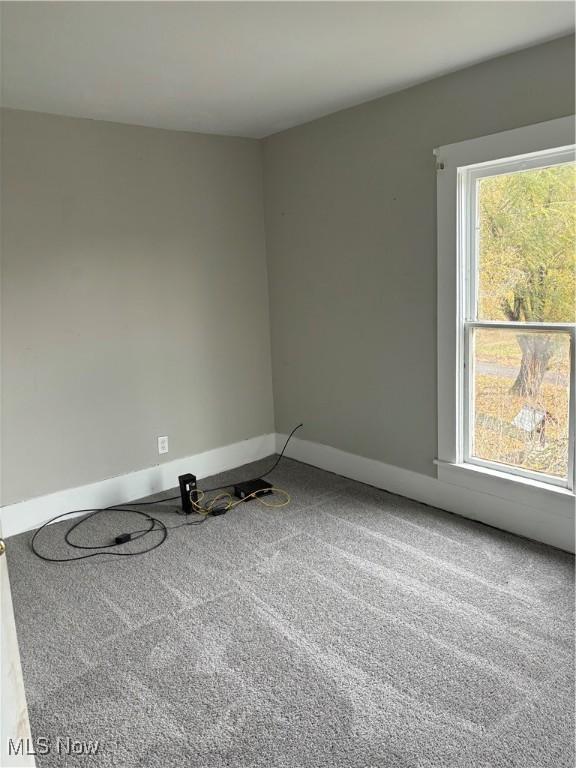 445 N 3rd, Cambridge, OH 43725 - carpeted empty room featuring plenty of natural light