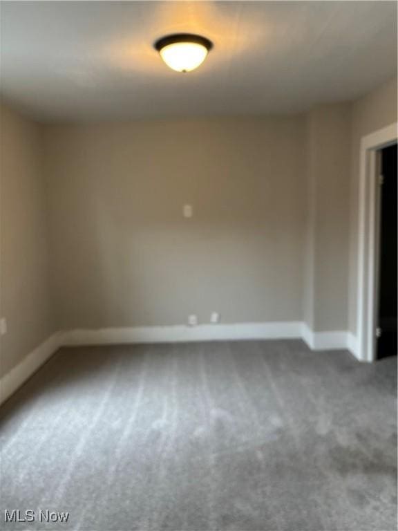 445 N 3rd, Cambridge, OH 43725 - carpeted empty room featuring baseboards