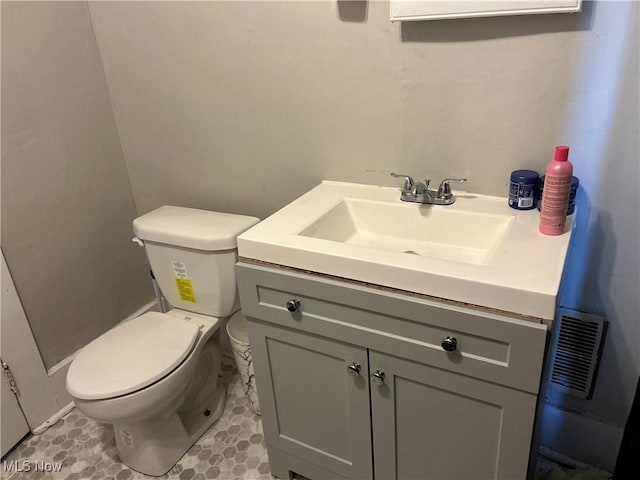 445 N 3rd, Cambridge, OH 43725 - half bathroom featuring vanity and toilet