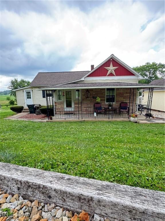 254 Spring Mountain Rd, Warsaw, OH 43844 - rear view of property with a lawn and a porch