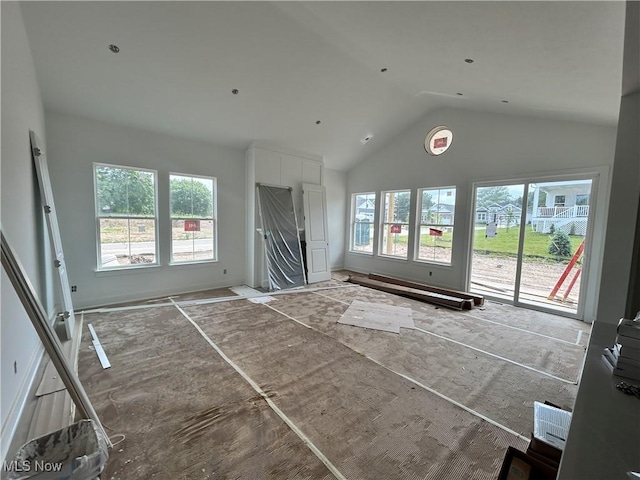 8928 Camden Rd NW, Massillon, OH 44646 - unfurnished living room with high vaulted ceiling