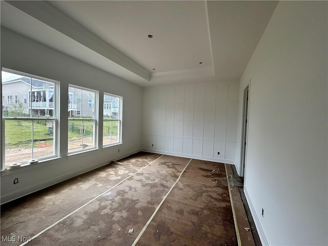 8928 Camden Rd NW, Massillon, OH 44646 - unfurnished room with a tray ceiling and baseboards
