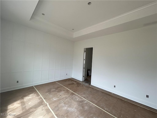 8928 Camden Rd NW, Massillon, OH 44646 - unfurnished bedroom with a tray ceiling and baseboards