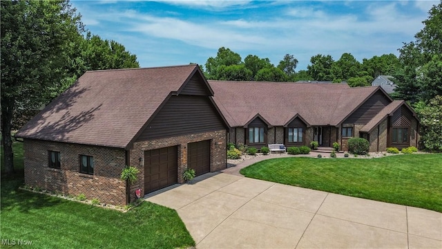 5507 13th Ave, Vienna, WV 26105 - english style home with brick siding, a front yard, a garage, and driveway