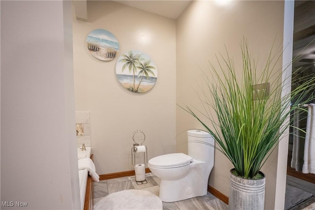 5507 13th Ave, Vienna, WV 26105 - bathroom featuring toilet and baseboards