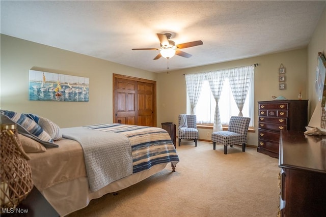 5507 13th Ave, Vienna, WV 26105 - bedroom featuring light colored carpet, a ceiling fan, and a closet