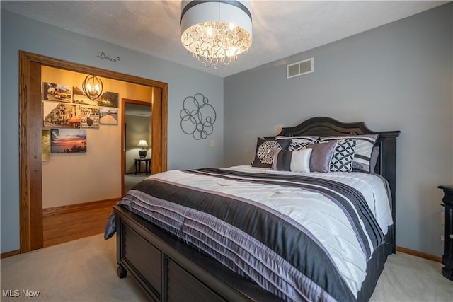 5507 13th Ave, Vienna, WV 26105 - bedroom featuring a chandelier and light carpet