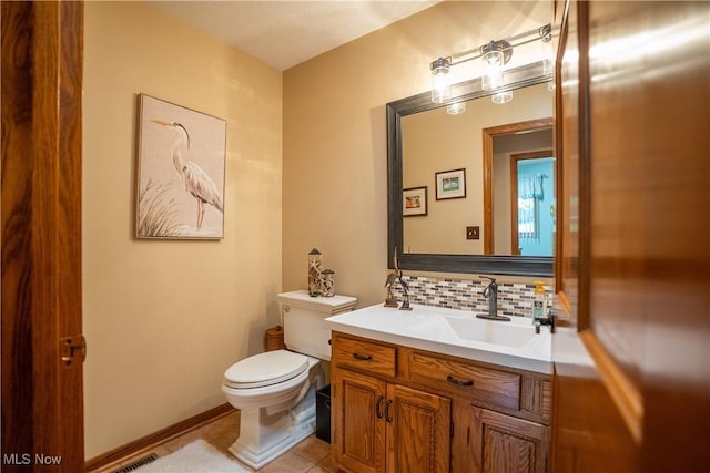 5507 13th Ave, Vienna, WV 26105 - half bath featuring backsplash, vanity, and tile patterned floors