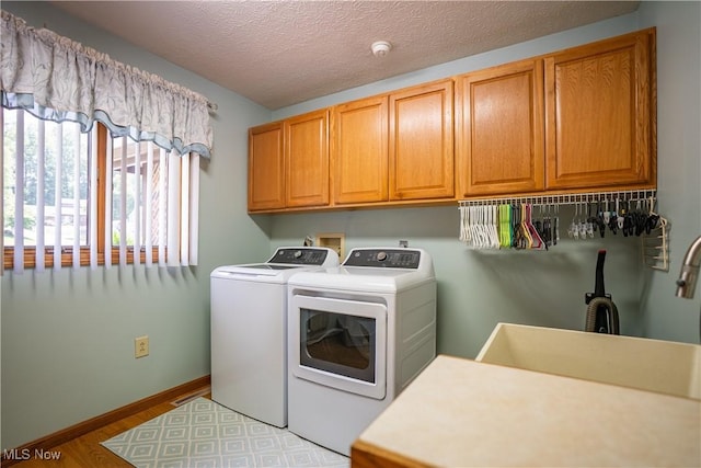 5507 13th Ave, Vienna, WV 26105 - washroom featuring independent washer and dryer, cabinet space, and wood finished floors