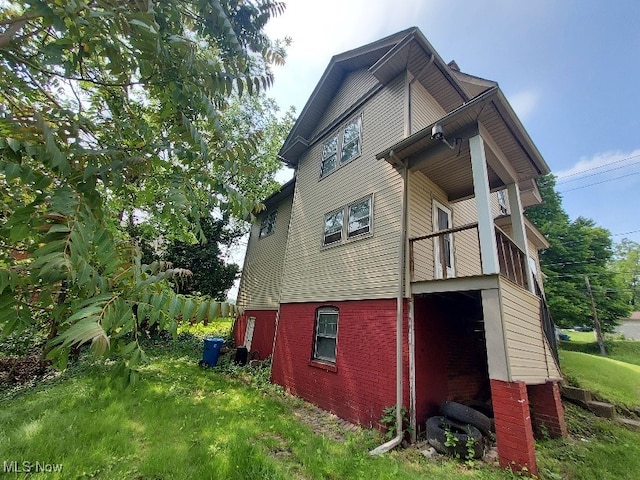 84 Lowellville Rd, Struthers, OH 44471 - rear view of house featuring brick siding