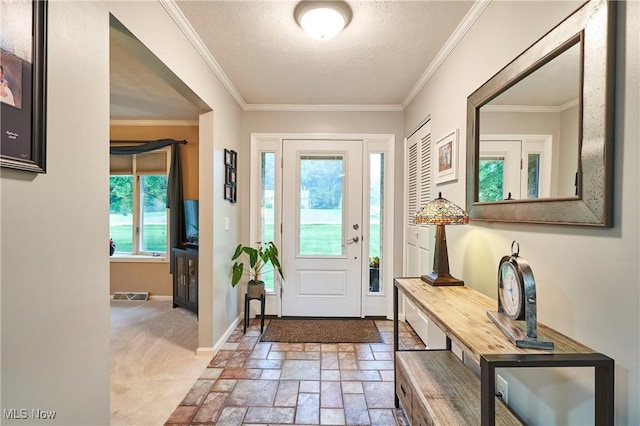 3145 Franks Rd, Clinton, OH 44216 - entrance foyer featuring crown molding, stone tile flooring, a textured ceiling, and carpet floors