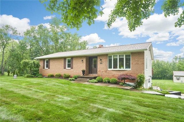 3145 Franks Rd, Clinton, OH 44216 - single story home with a front yard, a chimney, and brick siding