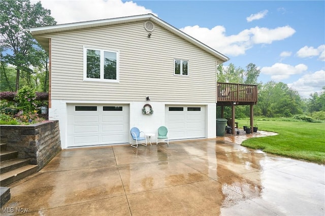 3145 Franks Rd, Clinton, OH 44216 - view of front facade featuring a garage, a front yard, concrete driveway, and a wooden deck