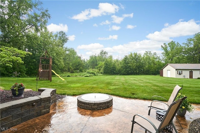 3145 Franks Rd, Clinton, OH 44216 - view of patio with a fire pit