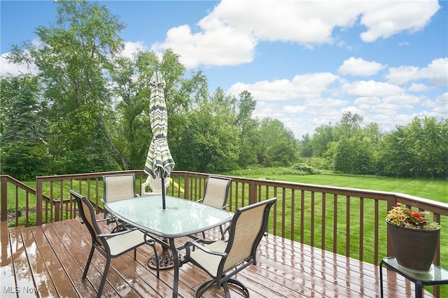 3145 Franks Rd, Clinton, OH 44216 - deck with outdoor dining area and a lawn