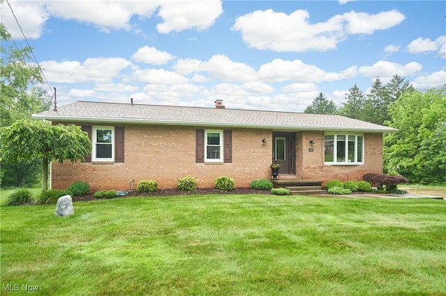 3145 Franks Rd, Clinton, OH 44216 - ranch-style house featuring brick siding, a front yard, and a chimney