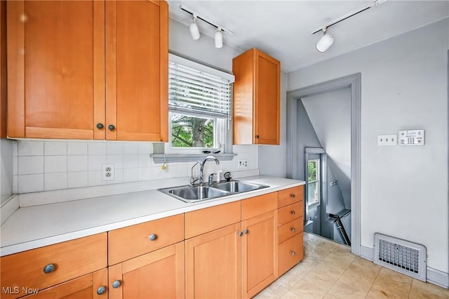 341 Kenmore Ave NE, Warren, OH 44483 - kitchen with track lighting, light countertops, decorative backsplash, and light tile patterned floors