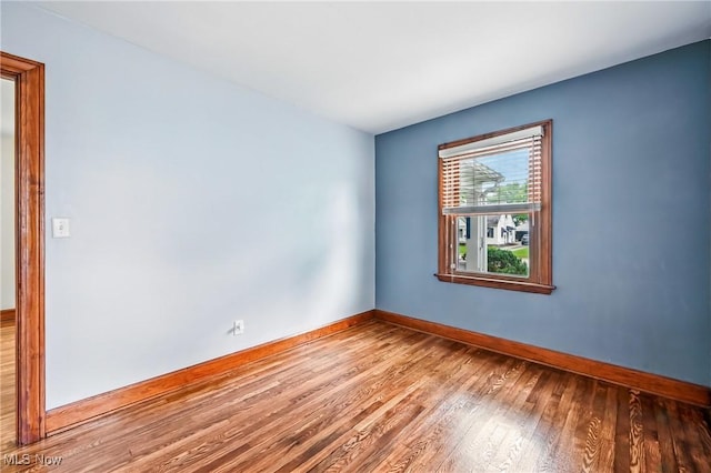 341 Kenmore Ave NE, Warren, OH 44483 - empty room featuring wood finished floors and baseboards