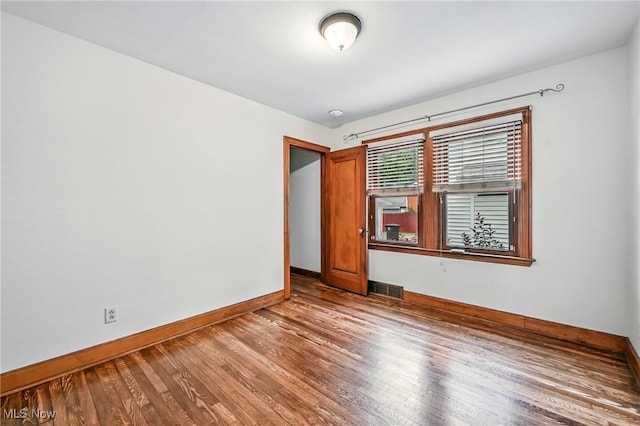 341 Kenmore Ave NE, Warren, OH 44483 - spare room featuring baseboards and wood finished floors