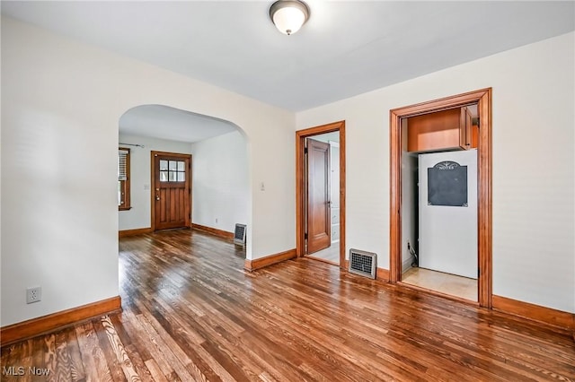 341 Kenmore Ave NE, Warren, OH 44483 - spare room with arched walkways and wood finished floors